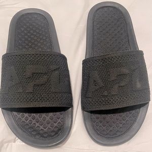 Brand new APL Techloom slides in black. Women’s size 7